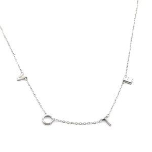Sterling silver chain necklace with minimalist VOTE letter charms on a white background