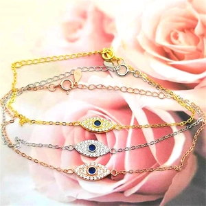 Detail of S925 sterling silver evil eye bracelets in gold silver and rose gold finishes