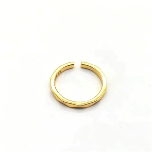 Detailed macro view of S925 sterling silver gold plated ring with wave texture