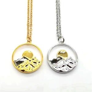 Fashionable mountain and sun mountain pendant necklace in gold and silver color finish