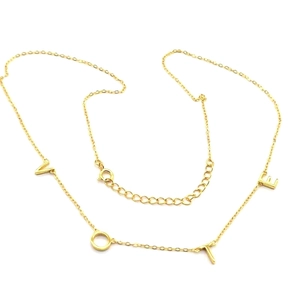 Close-up of gold S925 sterling silver VOTE letter pendant with adjustable chain extender