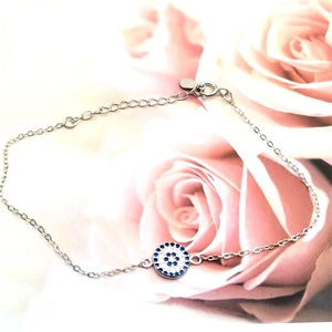 Close-up of S925 sterling silver evil eye bracelet with blue and white zircons