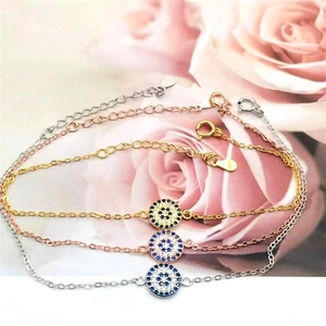 Detail of S925 sterling silver Evil Eye bracelets in gold, rose gold and silver finishes