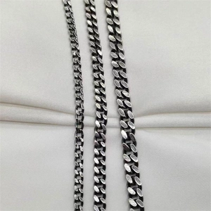 Detail view of vintage S925 silver Cuban chains in three different widths and brushed finish
