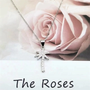 S925 sterling silver palm tree pendant necklace with shimmering cubic zirconia stones