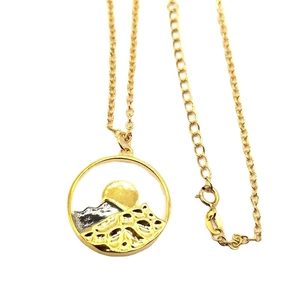 Golden delicate necklace with circular relief mountain and sun landscape pendant
