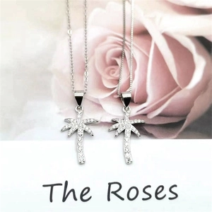 S925 sterling silver palm tree pendant necklace with shimmering cubic zirconia stones