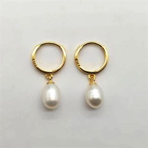 Detailed macro view of S925 hallmark on gold plated silver freshwater pearl earrings