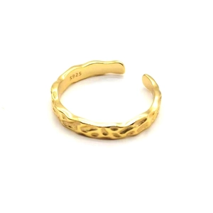 Close-up of golden hammered texture S925 sterling silver open ring detailing