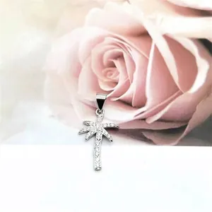 Close-up of S925 sterling silver palm tree pendant with micro-set zircon stones