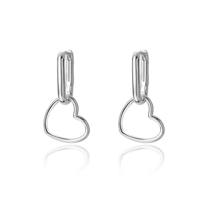 Detailed view of polished S925 sterling silver heart-shaped drop earrings on white