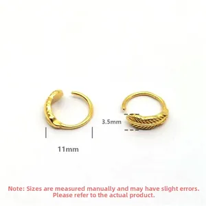 Detail view of gold leaf hoop earrings with 11mm outer diameter and engraved textures