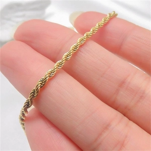 Close-up of golden S925 sterling silver rope chain bracelet with polished finish detail