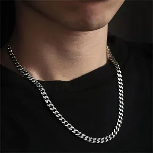 Macro detail of high-polished S925 sterling silver Cuban link chain with flat tight links