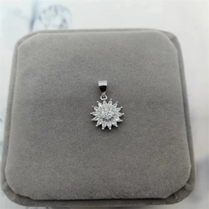 Detailed view of S925 silver sunflower pendant with marquise-cut stones on velvet box