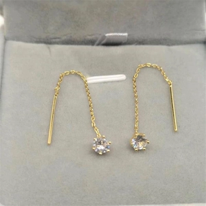 Detail of S925 gold plated long tassel earrings with sparkling six-claw zircon crystals