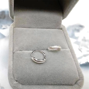 S925 sterling silver leaf ear clips with detailed feather carving in a jewelry box