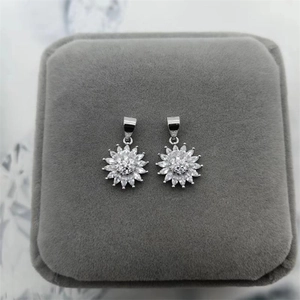 Close-up of S925 sterling silver sunflower pendant with glittering zircon stones