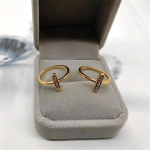 Elegant gold-plated S925 sterling silver T-shaped rings with inlaid zircons in a box