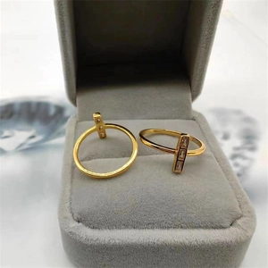 Macro view of gold S925 silver rings showing rectangular zircon inlay and S925 stamp
