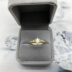Elegant S925 silver gold plated ring with marquise opal and side diamonds in jewelry box
