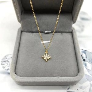Elegant gold-plated S925 silver necklace with sparkling star pendant on grey velvet box