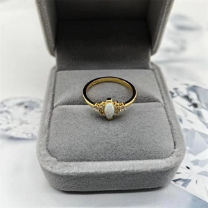 S925 sterling silver gold plated opal ring with side diamonds in a jewelry box