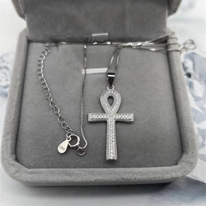 Macro shot of S925 sterling silver Ankh pendant with shimmering cubic zirconia inlay