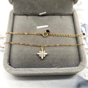 Detailed view of an S925 gold-plated star pendant with cubic zirconia in a jewelry box
