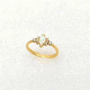 Macro shot of S925 sterling silver ring featuring marquise opal and sparkling side diamonds