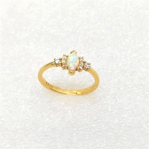 Detailed top view of gold S925 ring with marquise opal and white zircon stones