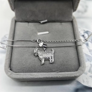 Detailed close-up of S925 sterling silver goat pendant with micro-pave crystals in a box