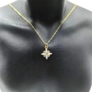 Detailed view of an S925 silver gold-plated eight-pointed star pendant on a neck mannequin