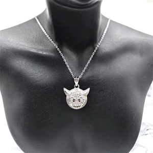 Detailed close-up of S925 sterling silver devil face pendant with white and purple zircons