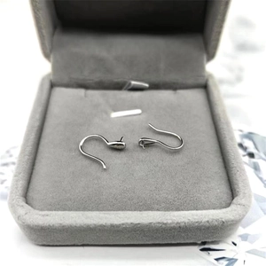 Macro view of S925 sterling silver spoon-shaped earring hooks for DIY jewelry making