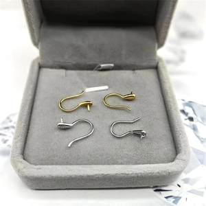 Macro view of S925 sterling silver French ear hooks in gold and silver for DIY jewelry