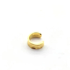 Detailed macro view of S925 sterling silver stamp on the inner band of the gold ear cuff