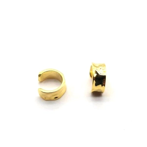 Detailed view of gold plated S925 silver ear cuffs with irregular hammered texture finish