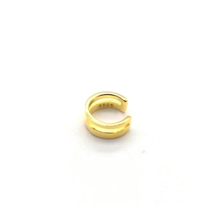 Macro detail of S925 hallmark on a double-layer golden ear cuff for non-pierced ears