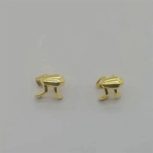 Detailed top view of gold-plated frog ear clips with a polished metallic finish