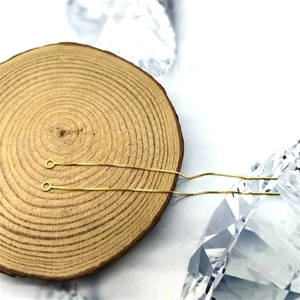 Detail of DIY S925 silver box chain earring accessories with golden finish and needles
