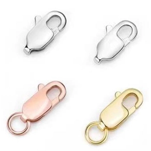 Macro view of lobster clasps in silver, white gold, rose gold and gold plating