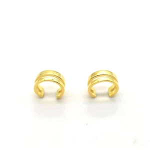 Detail view of gold double-layer C-shaped ear cuffs with a sleek minimalist design