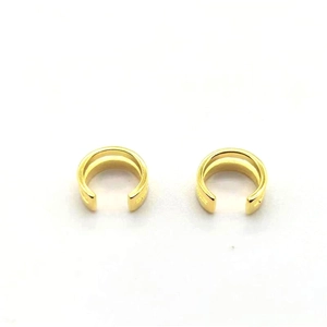 Detailed view of gold-plated double-layer C-shaped ear cuffs on a white background