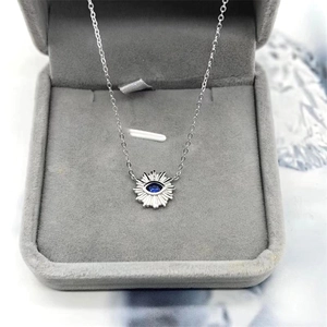 S925 sterling silver evil eye sun necklace with blue stone in a velvet jewelry box