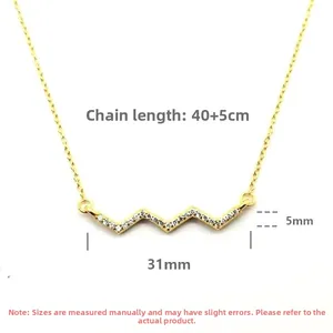 Detail of gold heartbeat pendant with micro-pave crystals and 40+5cm extension chain