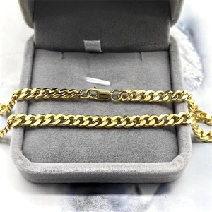 Classic gold-plated Cuban link necklace with lobster clasp in a jewelry box gift display