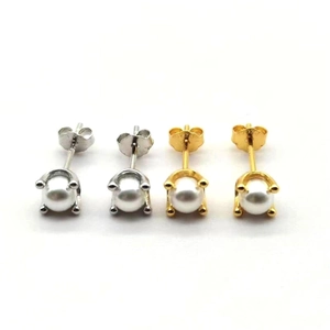 Close-up of S925 sterling silver pearl studs in gold and silver showing hallmark stamp
