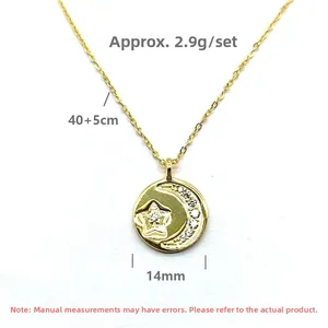 Detail view of gold star and moon pendant showing 14mm diameter and 40+5cm chain length