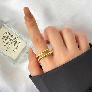 Minimalist double layer gold S925 sterling silver open ring on female model's finger
